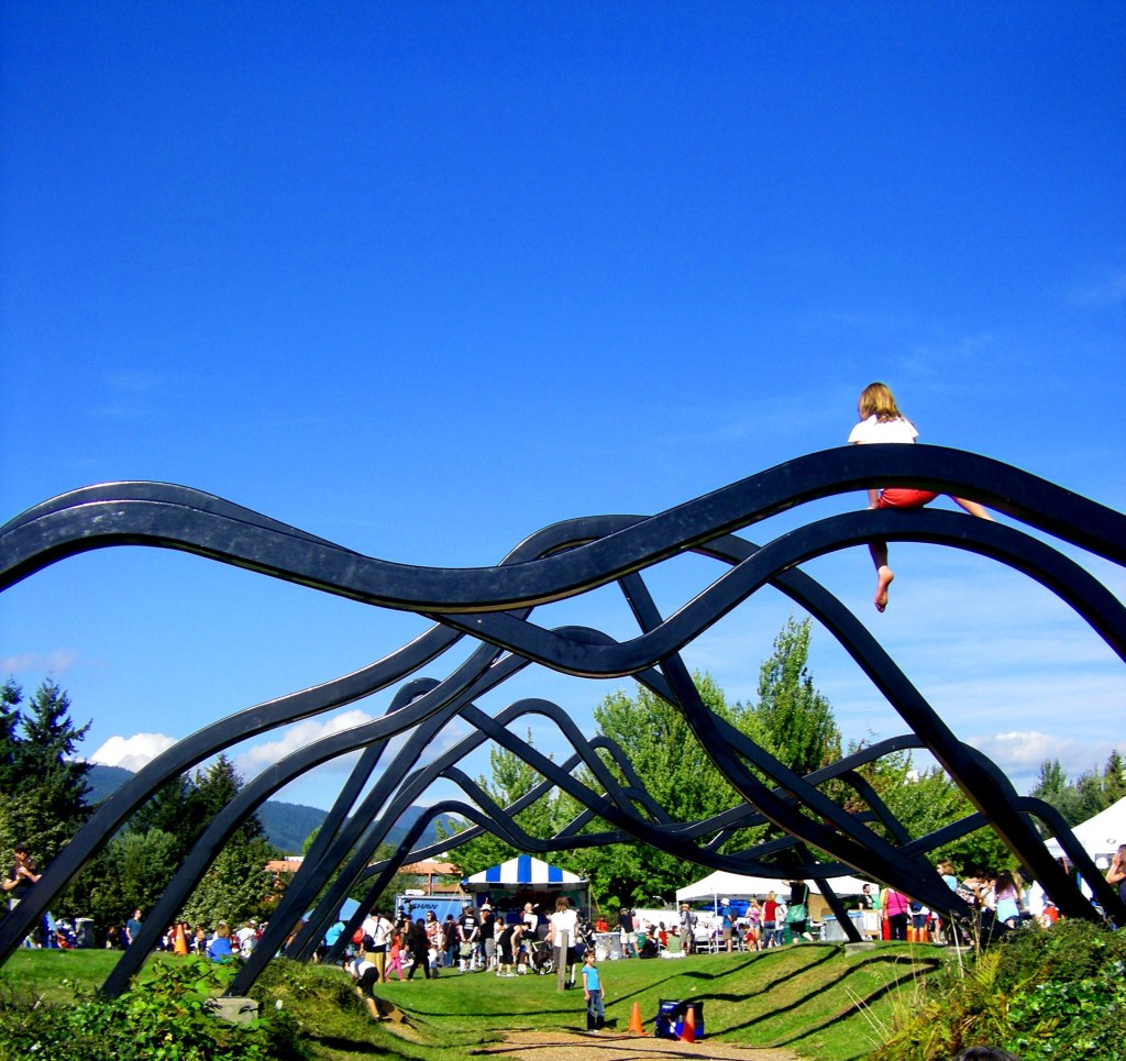 Take a bigger ferry (seabus) across Burrard Inlet to visit beautiful Waterfront park North Vancouver. Climb up sculptures (mountain sized with mountain backdrops) that warn you 'don't climb' ... and you do if you're ten or so!